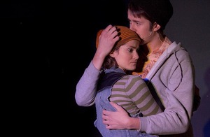 (From Left) Natalie, played by Kate Metroka, hugs her boyfriend Henry, played by Tim Murray, at the Red House's production of 