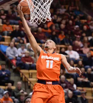 Tyler Ennis elevates for a layup in Syracuse's 72-52 win against Virginia Tech. Ennis finished with 13 points and seven assists, keying the Orange's 16-0 second-half run.