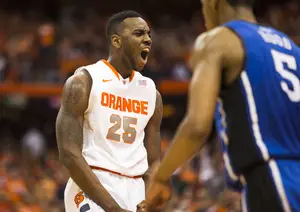 Rakeem Christmas celebrates in No. 2 Syracuse's 91-89 win over No. 17 Duke at the Carrier Dome on Saturday. The win gives the Orange the best start in program history at 21-0. 