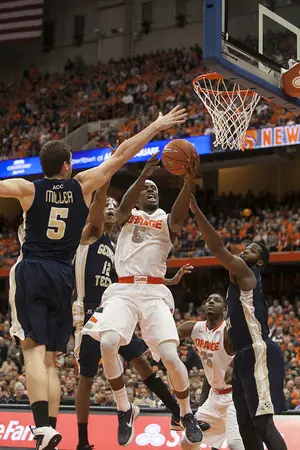 C.J. Fair attempts a layup in a crowd of Georgia Tech defenders in Syracuse's 67-62 loss to the Yellow Jackets on Tuesday. On Senior Night, and fellow rotational senior Baye Moussa Keita, were unable to win in their final game in the Carrier Dome. 