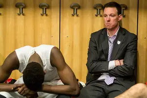 Jerami Grant hangs his head after Syracuse's 55-53 loss to Dayton while assistant coach Gerry McNamara sits next to him. Grant took just three shots and fouled out in 34 minutes.