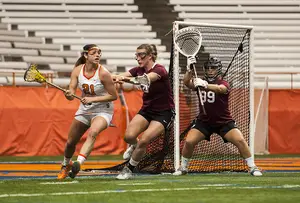 Sophomore Kayla Treanor looks for a cutting teammate in Syracuse's 17-4 win over Harvard on Tuesday night. 