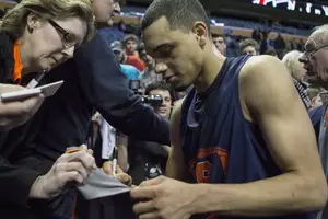 Tyler Ennis signs an autograph after Syracuse's practice in Buffalo on Wednesday. 