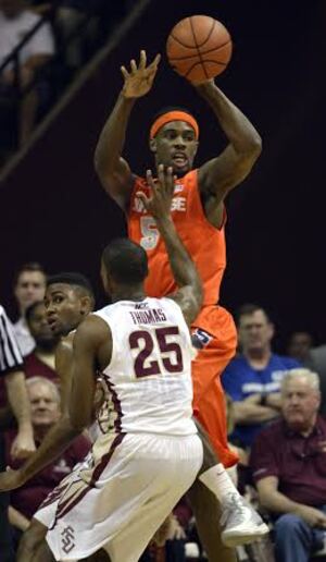 C.J. Fair throws a pass over Florida State's Aaron Thomas in No. 7 Syracuse's win over the Seminoles on Sunday. Fair paced the Orange with a game-high 22 and scored 10 quick points to start the second half. 