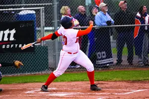 Jasmine Watson looks up at a ball after a big swing. The senior hit a home run and added another RBI in the Orange's 5-0 win over Niagara. 