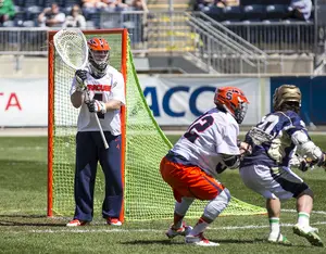 Syracuse goalie Bobby Wardwell (left) prepares for a Notre Dame shot in the team's 15-14 loss to the Fighting Irish in the ACC tournament final Sunday. 