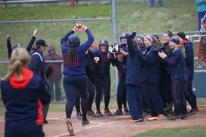 Jasmine Watson celebrates as she runs out the last few steps of her grand slam in Syracuse's 7-3 win over Virginia Tech on Sunday. 
