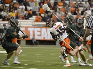 Randy Staats tries to break through the Binghamton defense. Staats finished with two goals as the Orange narrowly escaped the Bearcats 10-8 in the Carrier Dome on Wednesday.