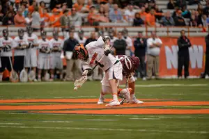 Chris Daddio wins a faceoff in Syracuse's 19-6 win over Colgate on Sunday. Daddio won 15-of-21 faceoffs before being replaced by Mike Iacono late in the third quarter. 