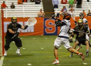 Kevin Rice winds up in front of Gunnar Waldt's net. The Bryant goalkeeper made eight saves on 18 SU shots in the fourth quarter, holding the Orange to nine goals in the Bulldogs' NCAA tournament first-round upset of Syracuse Sunday night in the Carrier Dome.