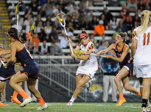 The Syracuse defense tries to slow down the Maryland in attack in a 15-12 loss the Terrapins on Sunday night. UMD scored 15 goals while capturing the national championship. 
