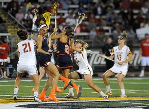 Syracuse and Maryland tussle for a draw control in the Terrapins' 15-12 national championship win over the Orange on Sunday night. 
