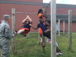 Tight end Kendall Moore, wide receiver Steve Ishmael and offensive lineman Seamus Shanley try to complete the self-suspension task.