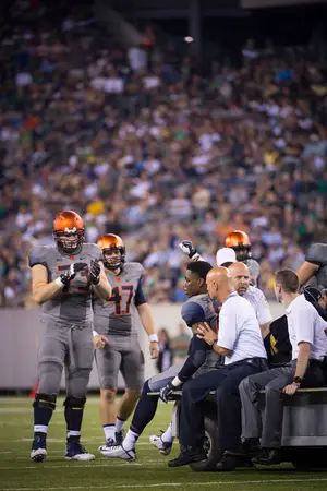 Kendall Moore leaves the game on a cart after sustaining a concussion in the fourth quarter in Syracuse's 31-15 loss to Notre Dame on Saturday night.