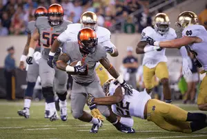 Syracuse receiver Brisly Estime is taken down by a Notre Dame defender in the Fighting Irish's 31-15 win over the Orange at MetLife Stadium on Saturday night. 