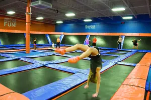 Jenna Downey, a freshman at Fayetteville-Manlius High School, does a backflip on a trampoline at Sky Zone, the new indoor trampoline park on Erie Boulevard. Sky Zone offers free jump as well as exercise classes, basketball and dodgeball.