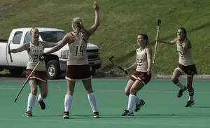 No. 11 Boston College celebrates its 3-2 overtime victory over No. 4 Syracuse on Saturday.