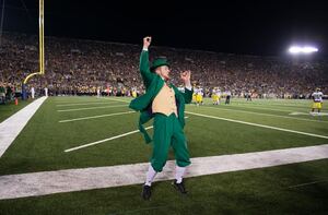 John Doran rallies the Notre Dame crowd from the sideline at a game. He became the Leprechaun this season and has garnered a lot of attention as a result. 