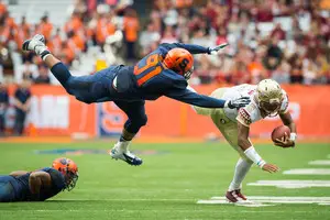Isaiah Johnson (91) and the Syracuse defensive line only came away with one sack, but applied pressure on Florida State quarterback Jameis Winston.