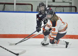 Dakota Derrer (right) played her first women’s ice hockey game when SU hosted Colgate on opening night. She only play with boys before college, and has been successful and made adjustments as a result. 