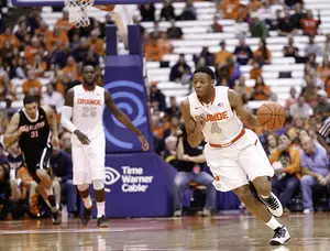 Sophomore Ron Patterson runs the floor during Syracuse's win over Carleton in the Carrier Dome on Sunday.