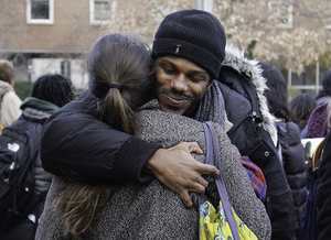 Colton Jones , a member of THE General Body, hugs another member of the group after THE General Body left Crouse-Hinds Hall after an 18-day sit-in.   