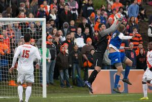Syracuse goalkeeper Alex Bono leaps to make a save in the Orange's 2-0 ACC tournament quarterfinal win over Duke. The junior recorded seven saves, tied for a season high, en route to his 12th shutout of the year.