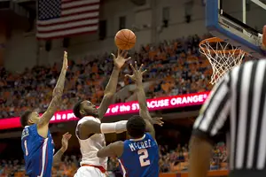 Rakeem Christmas puts up a left-handed hook shot during the first half of Sunday's game. He didn't have as good of a game as usual, forcing the likes of Trevor Cooney and Tyler Roberson to step up.