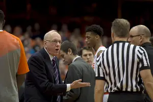 Jim Boeheim speaks with a referee during the second half of Sunday's narrow win. After the game, he voiced his concerns regarding his team's fundamentals.