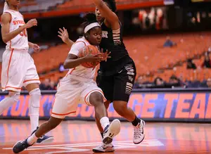 Syracuse point guard Alexis Peterson goes right at a Wake Forest defender during her 32-point performance.