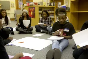 Komiyah Butler, a sixth-grader at Danforth Middle School, participates in a writing activity at the Dark Girls after-school workshop. The girls were asked to journal about how they see themselves in the mirror and draft manifestos for the program.