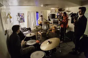 Pizza Party practices in a south campus apartment living room for shows. The band will headline at the Westcott Theater for its first public performance where Pizza Party will perform cover songs and original content.                                                            