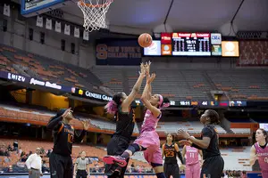 Briana Day gets up a shot attempt from the paint. She struggled to defend and score in the paint as Syracuse lost to Miami on Thursday. 