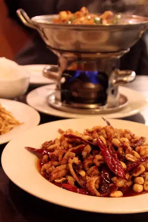 The Kung Pao squid, listed as a spicy dish, contains chili peppers and squid tentacles. Located near Armory Square, Tang Flavor boasts authentic Chinese food. The menu is split between “Real Chinese Food” and “Tang Flavor Chinese Food.”        