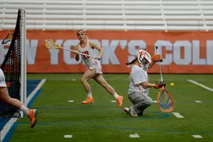 Kelsey Richardson drops to a knee on the Carrier Dome turf on Sunday. She turned in an improved performance from last weekend, guiding SU to a 19-7 win over Canisius.