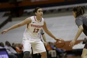 Syracuse junior Brianna Butler prepares to make a move on a Boston College defender on Thursday. Butler hit her first six 3s en route to a 22-point night.