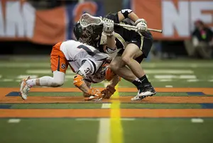 Ben Williams goes for a faceoff in SU's 12-9 win over Army at home on Sunday. He finished 21-of-25 at the X. 