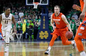 Syracuse guard Trevor Cooney dribbles upcourt during the Orange's 65-60 defeat of No. 9 Notre Dame on Tuesday night. He scored nine of his 11 points down the stretch to lead SU to the upset.