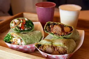 The chicken spiedie wrap is packed with raw spinach and organic chicken spiedies, a particular type of chicken special to New York. The mondo berry juice combines goji berries, blueberries and strawberries with other fruit for a healthy drink.