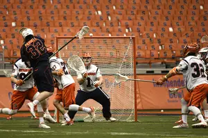 Bobby Wardwell braces for a shot on Sunday against Virginia. The senior goalkeeper posted 11 saves in the Orange's 15-9 win over the No. 5 Cavaliers.