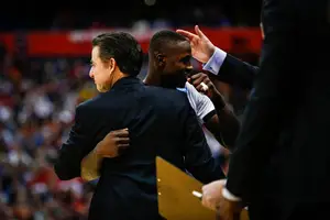 Rick Pitino and Terry Rozier hug in the waning moments of Louisville's 75-65 win over N.C. State. The game was followed with emotion from both locker rooms. 