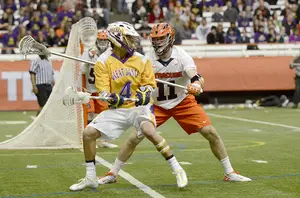 Syracuse's Brandon Mullins (11) will mark Albany's Lyle Thompson (4), the country's leading point scorer, on Thursday. The Great Danes' offense scores more goals per game than any other D-I team in the country.