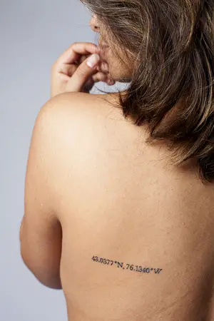Chantal Felice translated her love of SU by getting a tattoo of the university’s coordinates on the back of her left shoulder. 