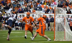 Syracuse senior Randy Staats follows through on a shot for one of his four goals during the Orange's 18-5 win.
