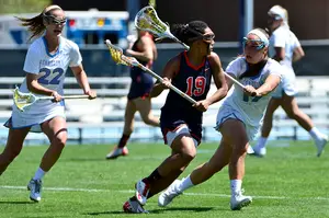 Although only 5 feet, 2 inches, Taylor Poplawski's tough and aggressive style of play have earned her a spot as a contributor on Syracuse's second-line midfield.