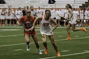 Maddy Huegel was torn between hockey and lacrosse coming out of high school, but ultimately chose to play the latter at Syracuse. Techniques and skills she developed playing hockey have helped her in areas on the lacrosse field, like winning ground balls and controlling draws. 