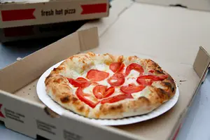 The tomato pie pizza was one of several options served up by Toss ‘n’ Fire’s food truck. The flavors of sweet tomato contrasted well with the creamy white sauce.