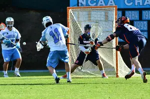 Syracuse backup goalie Warren Hill braces for a shot from Joey Sankey on Saturday. Hill made five saves on 12 shots in the second half after replacing Bobby Wardwell at halftime.