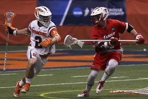 Kevin Rice comes around the goal. He had a career-high nine points in SU's win over Marist on Sunday. 