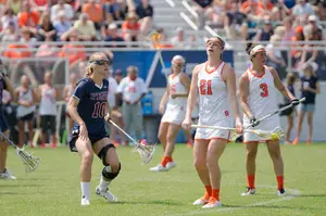 Kayla Treanor stands while letting the clock run down. Syracuse held the ball one a single possession for five of the game's final eight minutes.